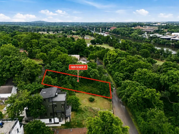 Green summer aerial with 1909 Sevier Street lot outline
