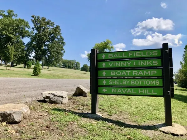 Shelby Park sign showing ball fields, VinnyLinks, boat ramp, Shelby Bottoms and Naval Hill