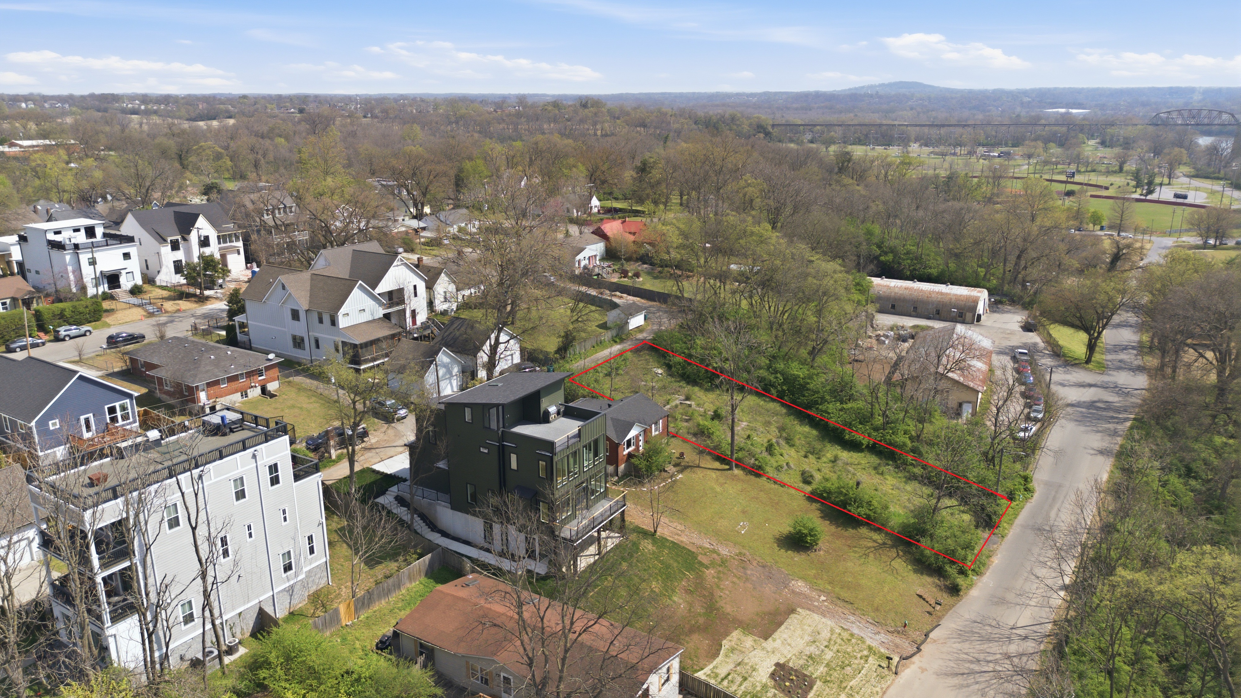 Lot in context with modern homes nearby